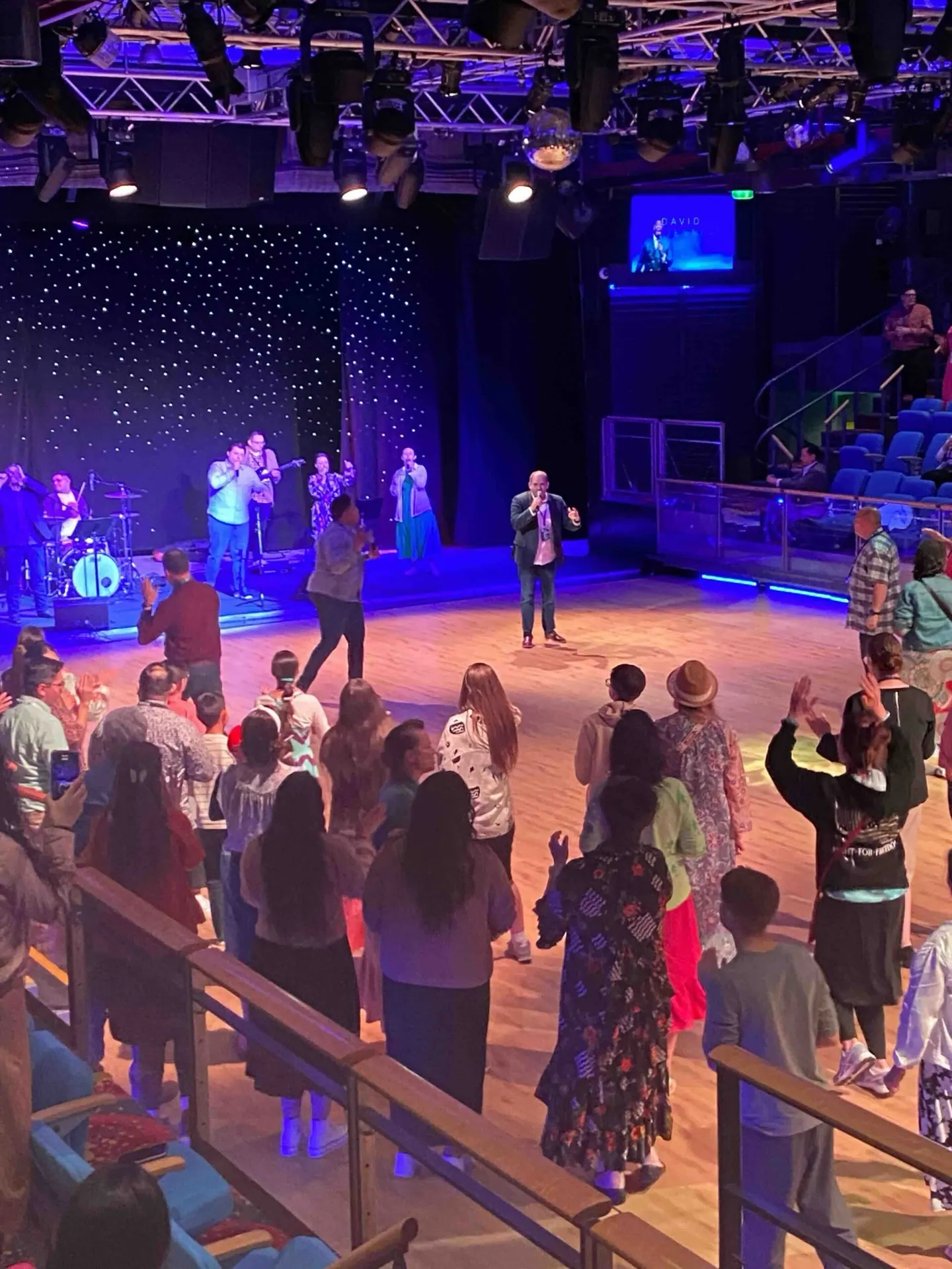Guests worshipping in front of the stage